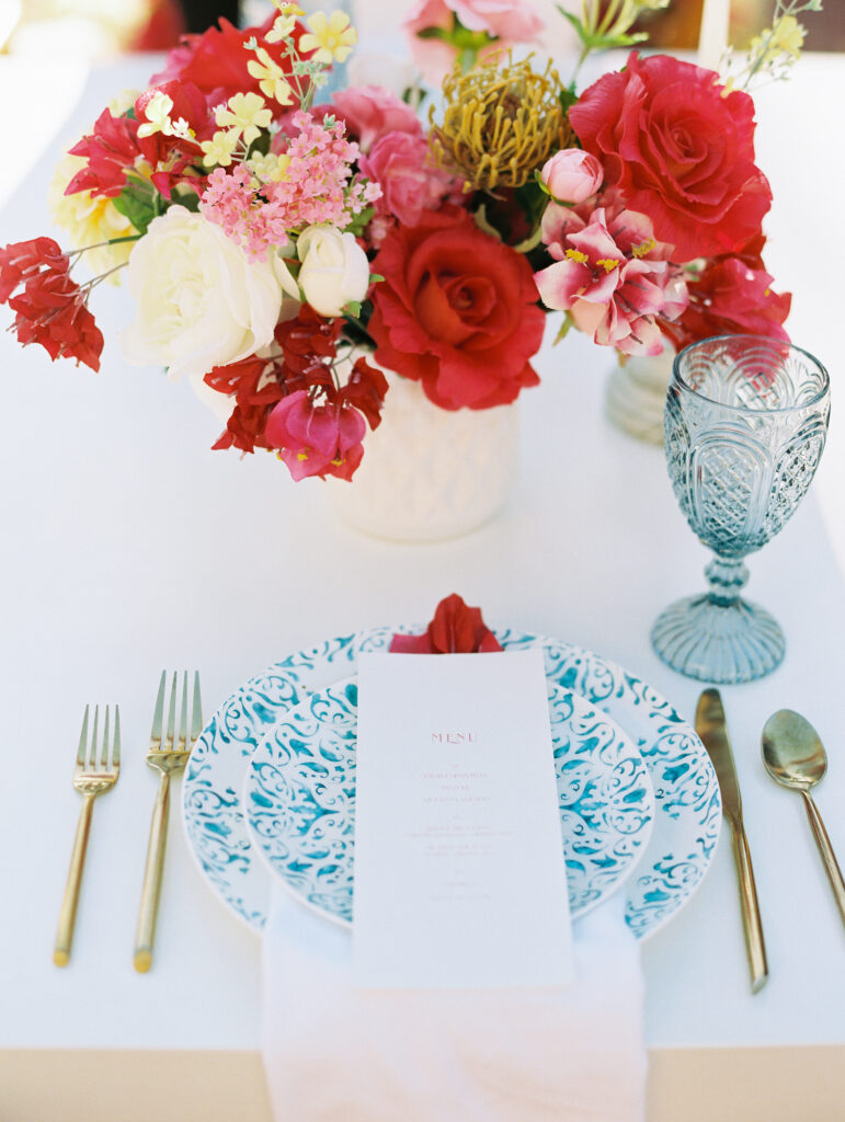 Colorful floral arrangement at a dinner table.