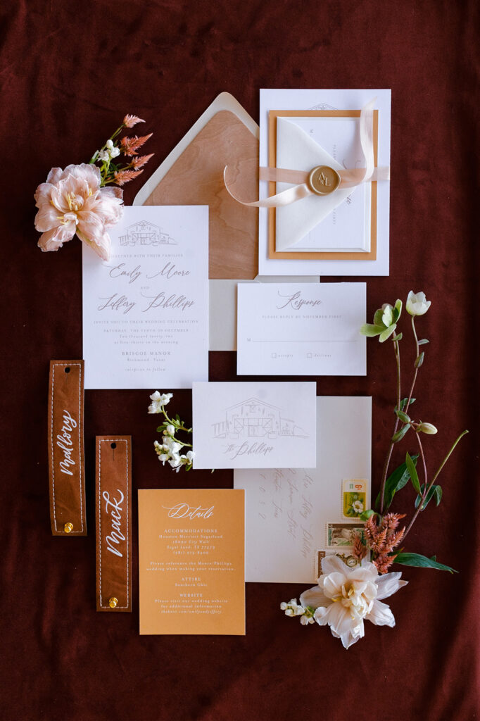 A fall inspired wedding invitation suite with accenting flowers